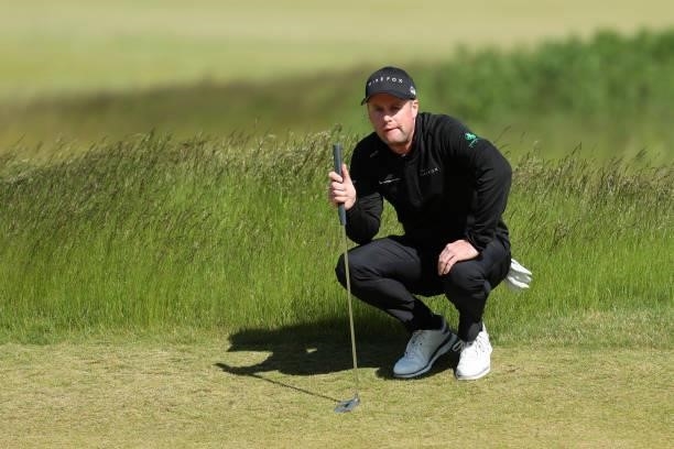 Jonathan Caldwell of Northern Ireland lines up a putt on the 13th hole during the third round of The Scandinavian Mixed Hosted by Henrik and Annika...