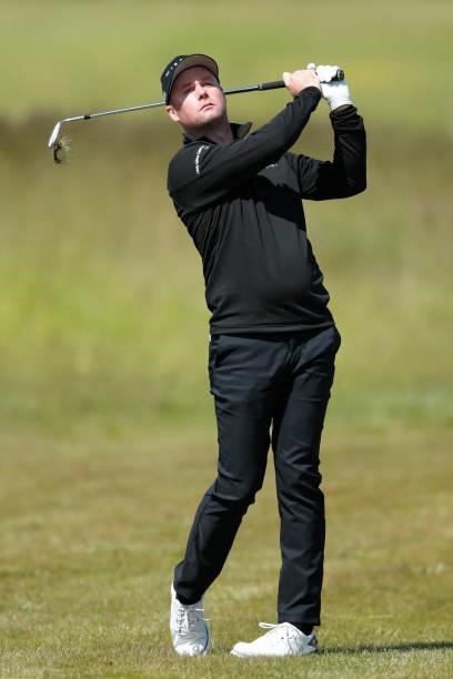 Jonathan Caldwell of Northern Ireland hits his second shot on the 18th hole during the third round of The Scandinavian Mixed Hosted by Henrik and...