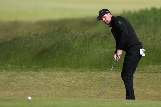 Jonathan Caldwell of Northern Ireland chips on the 13th hole during the third round of The Scandinavian Mixed Hosted by Henrik and Annika at Vallda...