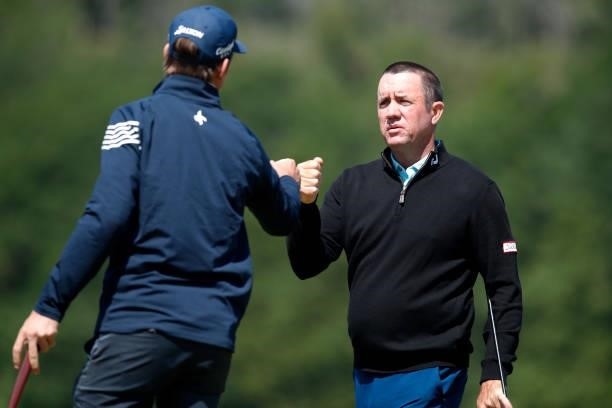 Scott Hend of Australia reacts to Pedro Figueiredo of Portugal on the 18th hole during the third round of The Scandinavian Mixed Hosted by Henrik and...