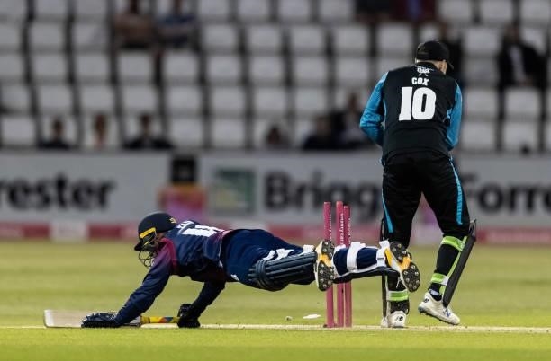 Saif Zaib of Northamptonshire Steelbacks is run out by wicketkeeper Ben Cox of Worcestershire Rapids during the Vitality T20 Blast match between...