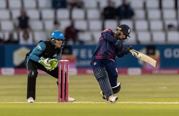 Saif Zaib of Northamptonshire Steelbacks hits out as wicketkeeper Ben Cox of Worcestershire Rapids looks on during the Vitality T20 Blast match...
