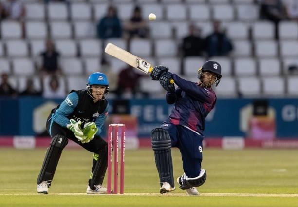 Saif Zaib of Northamptonshire Steelbacks hits out as wicketkeeper Ben Cox of Worcestershire Rapids looks on during the Vitality T20 Blast match...