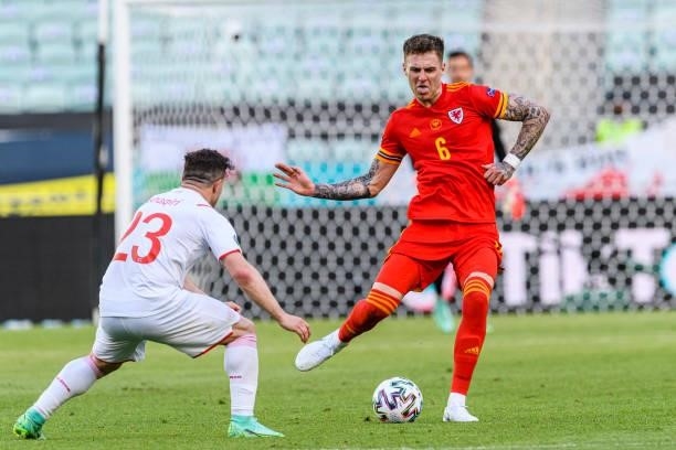 Joe Rodon of Wales passes the ball during the UEFA Euro 2020 Championship Group A match between Wales and Switzerland on June 12, 2021 in Baku,...