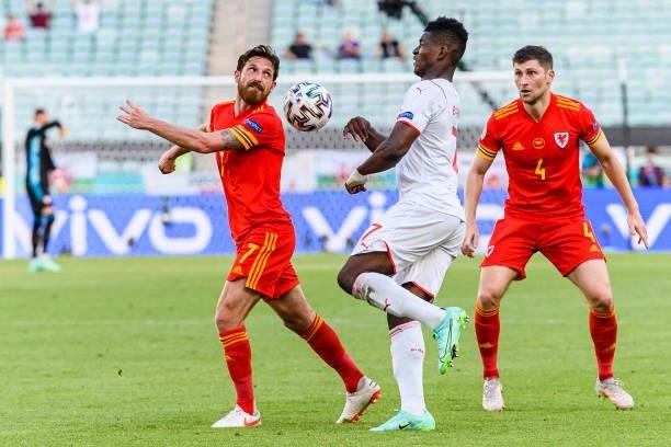 Joe Allen of Wales fights for the ball with Breel Embolo of Switzerland during the UEFA Euro 2020 Championship Group A match between Wales and...