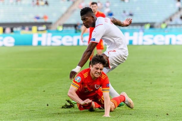 Daniel James of Wales is challenged by Breel Embolo of Switzerland during the UEFA Euro 2020 Championship Group A match between Wales and Switzerland...
