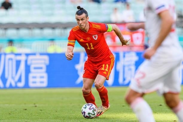 Gareth Bale of Wales runs with the ball during the UEFA Euro 2020 Championship Group A match between Wales and Switzerland on June 12, 2021 in Baku,...