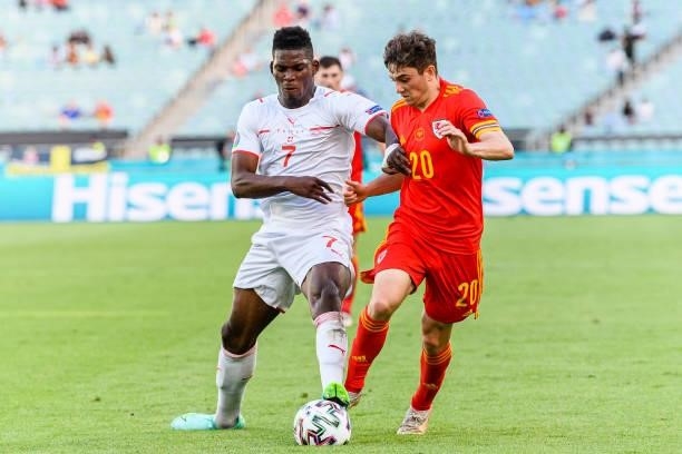 Daniel James of Wales fights for the ball with Breel Embolo of Switzerland during the UEFA Euro 2020 Championship Group A match between Wales and...