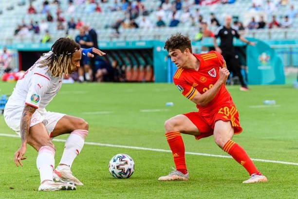 Daniel James of Wales plays against Kevin Mbabu of Switzerland during the UEFA Euro 2020 Championship Group A match between Wales and Switzerland on...
