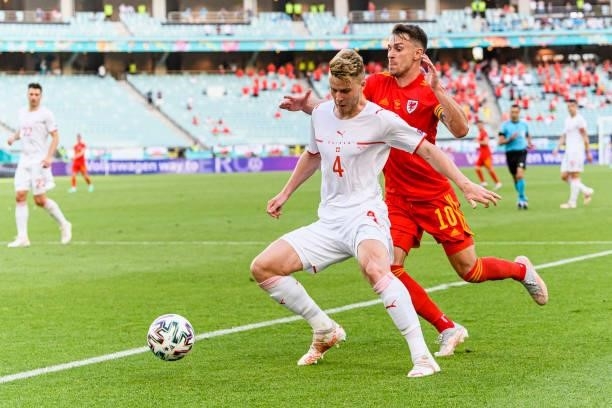 Nico Elvedi of Switzerland defends the ball from Aaron Ramsey of Wales during the UEFA Euro 2020 Championship Group A match between Wales and...