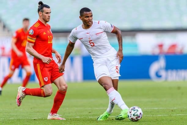 Manuel Akanji of Switzerland passes the ball during the UEFA Euro 2020 Championship Group A match between Wales and Switzerland on June 12, 2021 in...