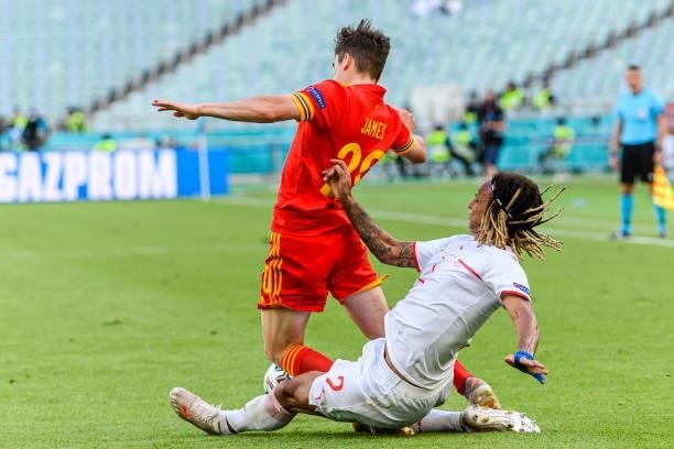 Daniel James of Wales is challenged by Kevin Mbabu of Switzerland during the UEFA Euro 2020 Championship Group A match between Wales and Switzerland...