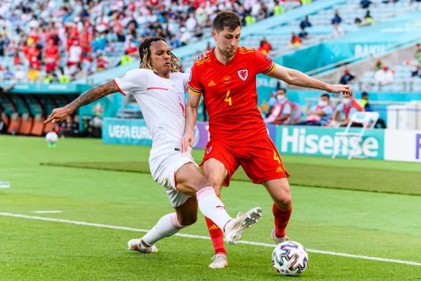 Ben Davies of Wales dribbles Kevin Mbabu of Switzerland during the UEFA Euro 2020 Championship Group A match between Wales and Switzerland on June...