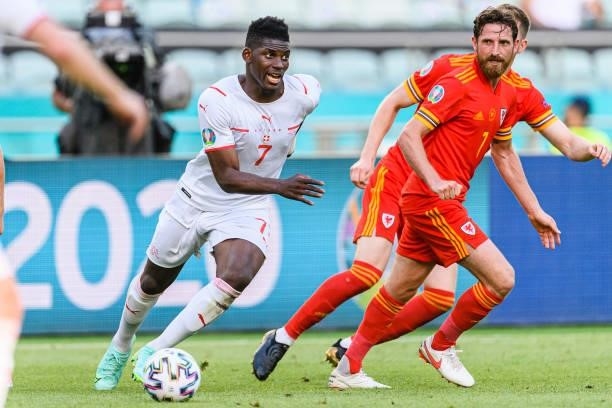 Breel Embolo of Switzerland runs with the ball during the UEFA Euro 2020 Championship Group A match between Wales and Switzerland on June 12, 2021 in...