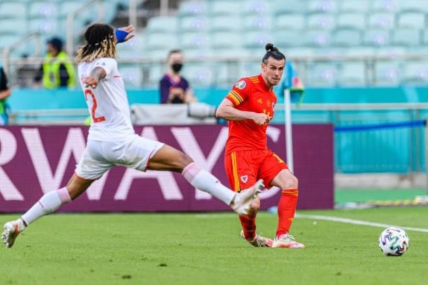 Gareth Bale of Wales plays against Kevin Mbabu of Switzerland during the UEFA Euro 2020 Championship Group A match between Wales and Switzerland on...