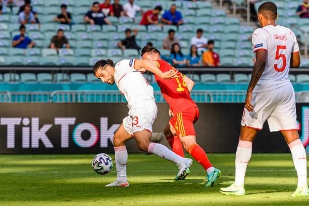 Ricardo Rodríguez of Switzerland plays against Connor Roberts of Wales during the UEFA Euro 2020 Championship Group A match between Wales and...