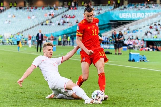 Nico Elvedi of Switzerland fights for the ball with Bale of Wales during the UEFA Euro 2020 Championship Group A match between Wales and Switzerland...