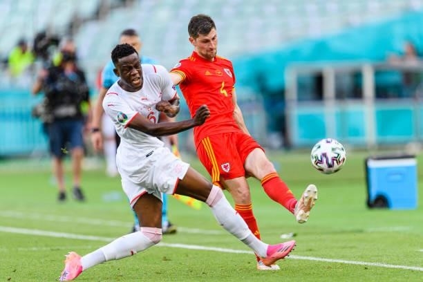 Denis Zakaria of Switzerland fights for the ball with Ben Davies of Wales during the UEFA Euro 2020 Championship Group A match between Wales and...