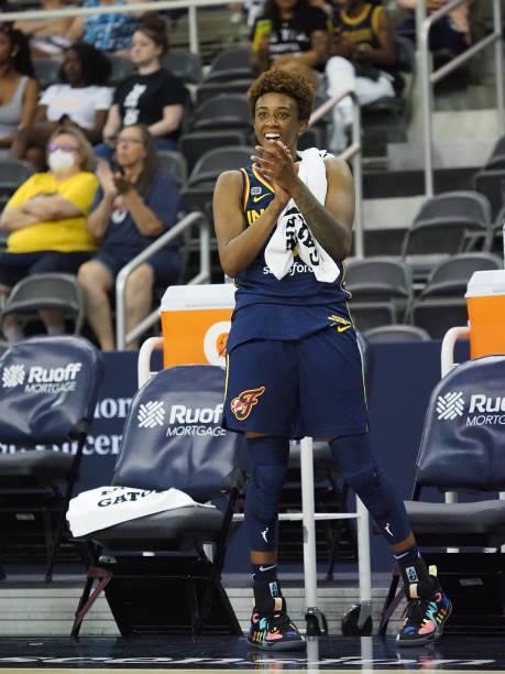 Danielle Robinson of the Indiana Fever cheers on teammates from the sideline during the game against the Chicago Sky on June 12, 2021 at Bankers Life...