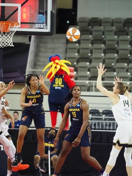 Kelsey Mitchell of the Indiana Fever passes the ball during the game against the Chicago Sky on June 12, 2021 at Bankers Life Fieldhouse in...