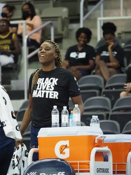 Jantel Lavender of the Indiana Fever smiles from the sideline during the game against the Chicago Sky on June 12, 2021 at Bankers Life Fieldhouse in...