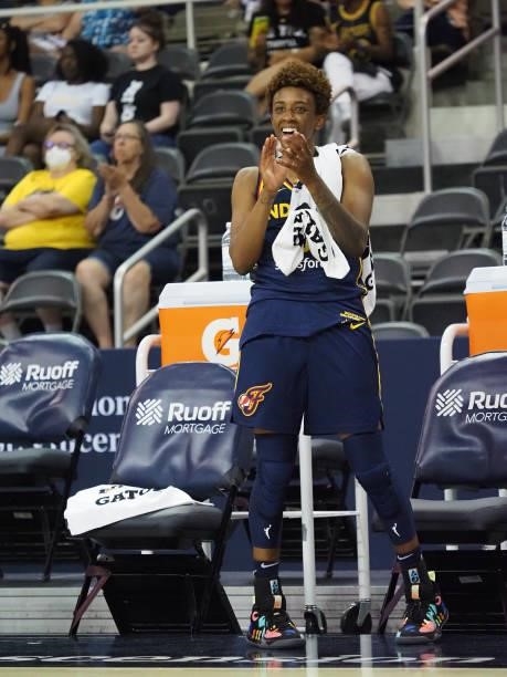 Danielle Robinson of the Indiana Fever cheers on teammates from the sideline during the game against the Chicago Sky on June 12, 2021 at Bankers Life...