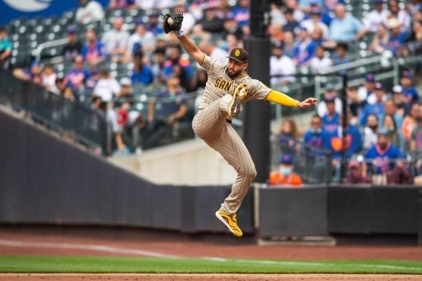 Eric Hosmer of the San Diego Padres leaps and catches the ball in the first inning against the New York Mets at Citi Field on June 12, 2021 in the...