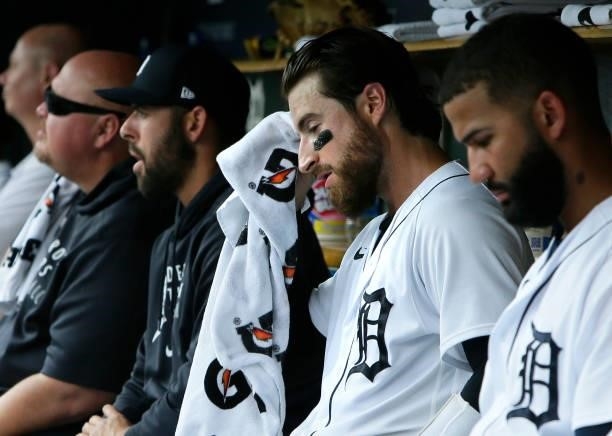 Eric Haase of the Detroit Tigers wipes the sweat from his face during the second inning of a game against the Chicago White Sox at Comerica Park on...