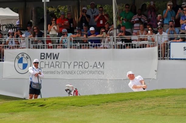 Boxer Canelo Alvarez of Mexico plays from the bunker on the 18th hole during the third round of the BMW Charity Pro-Am presented by Synnex...