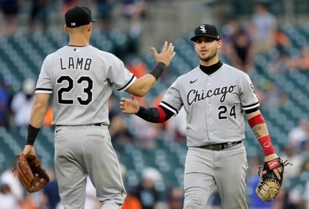 Jake Lamb of the Chicago White Sox celebrates with Yasmani Grandal after a 15-2 win over the Detroit Tigers at Comerica Park on June 12 in Detroit,...