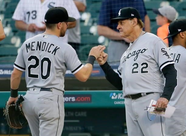 Danny Mendick of the Chicago White Sox receives a high-five from manager Tony La Russa after a 15-2 win over the Detroit Tigers at Comerica Park on...