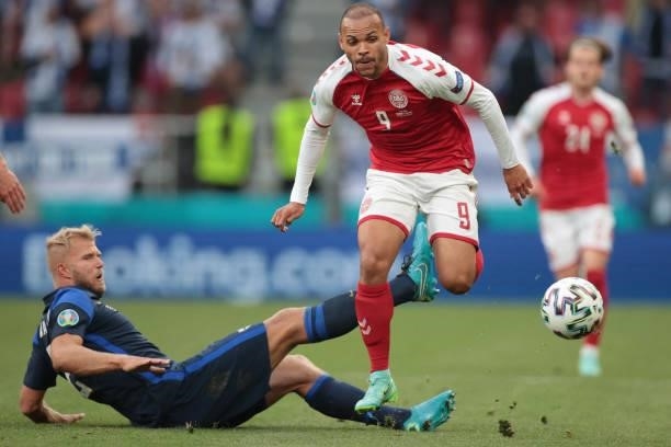 Finland's defender Paulus Arajuuri tackles Denmark's forward Martin Braithwaite during the UEFA EURO 2020 Group B football match between Denmark and...