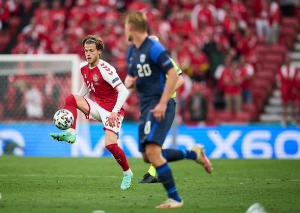Mathias Jensen of Denmark controls the ball during the UEFA EURO 2020 Group B match between Denmark and Finland at Parken Stadium on June 12, 2021 in...