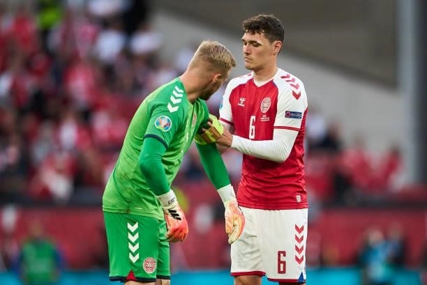 Andreas Christensen of Denmark hands over the captains arm band to Goalkeeper Kasper Schmeichel of Denmark during the UEFA EURO 2020 Group B match...