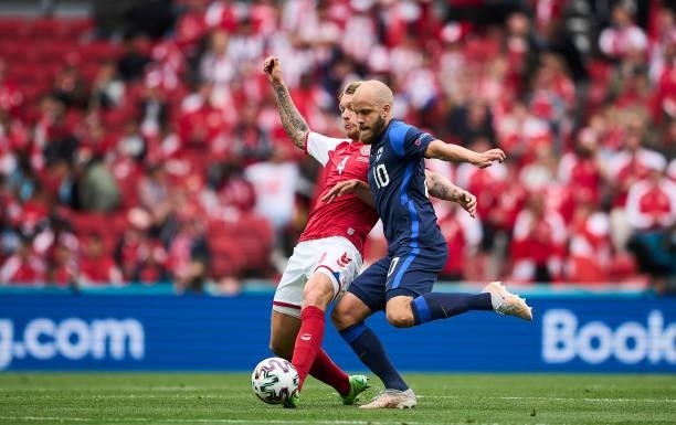 Simon Kjar of Denmark and Teemu Pukki of Finland compete for the ball during the UEFA EURO 2020 Group B match between Denmark and Finland at Parken...
