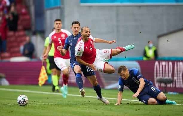 Robin Lod of Finland and Martin Braithwaite of Denmark compete for the ball during the UEFA EURO 2020 Group B match between Denmark and Finland at...