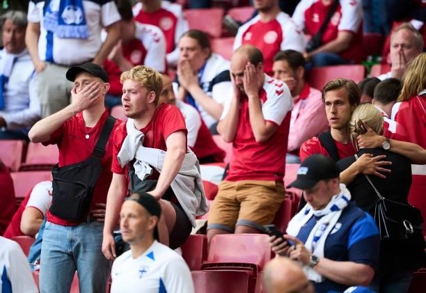 Danish fans showing emotions watching the medical treatment of Christian Eriksen during the UEFA EURO 2020 Group B match between Denmark and Finland...