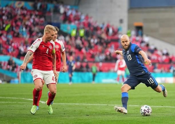Simon Kjar of Denmark and Teemu Pukki of Finland compete for the ball during the UEFA EURO 2020 Group B match between Denmark and Finland at Parken...