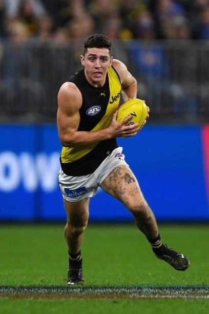 Jason Castagna of the Tigers runs with the ball during the 2021 AFL Round 13 match between the West Coast Eagles and the Richmond Tigers at Optus...