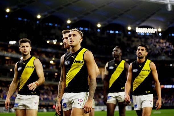 The Tigers leave the field after the teams defeat during the 2021 AFL Round 13 match between the West Coast Eagles and the Richmond Tigers at Optus...