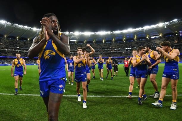 Nic Naitanui of the Eagles leads his team off after the win during the 2021 AFL Round 13 match between the West Coast Eagles and the Richmond Tigers...