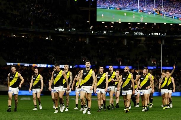 The Tigers leave the field after the teams defeat during the 2021 AFL Round 13 match between the West Coast Eagles and the Richmond Tigers at Optus...