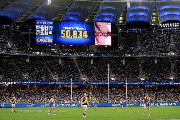 The crowd attendance can be seen during the 2021 AFL Round 13 match between the West Coast Eagles and the Richmond Tigers at Optus Stadium on June...