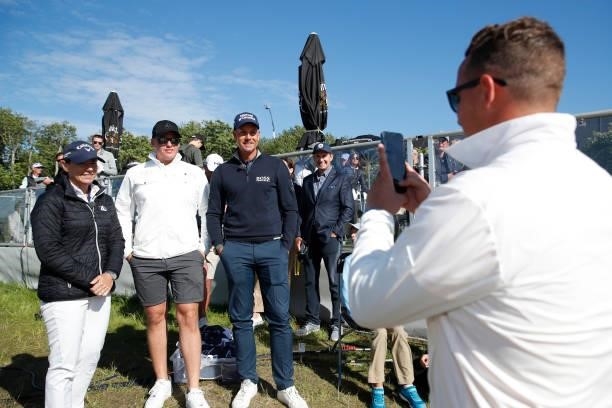Henrik Stenson of Sweden and Annika Sorenstam of Sweden pose with a fan by the 18th green during the final round of The Scandinavian Mixed Hosted by...