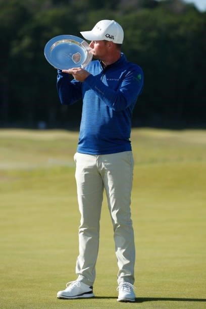 Jonathan Caldwell of Northern Ireland kisses the trophy after his win during the final round of The Scandinavian Mixed Hosted by Henrik and Annika at...