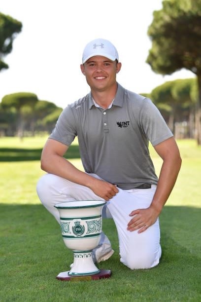 Kristof Ulenaers of Belgium poses with the trophy after his win during the final round of the Challenge de Cadiz at Iberostar Real Club de Golf Novo...