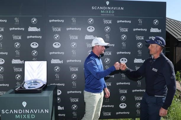 Jonathan Caldwell of Northern Ireland is congratulated by Henrik Stenson of Sweden after his win during the final round of The Scandinavian Mixed...