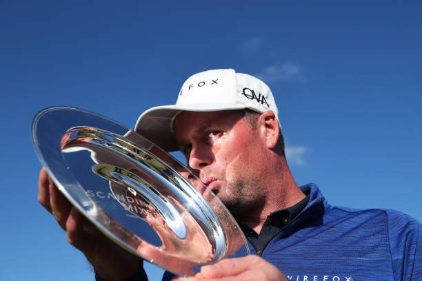 Jonathan Caldwell of Northern Ireland kisses the trophy after his win during the final round of The Scandinavian Mixed Hosted by Henrik and Annika at...