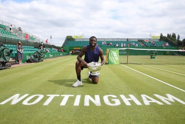 Frances Tafore of United States holds the Men's Singles Vikings Open Trophy after he beat Denis Kudla of United States at Nottingham Tennis Centre on...