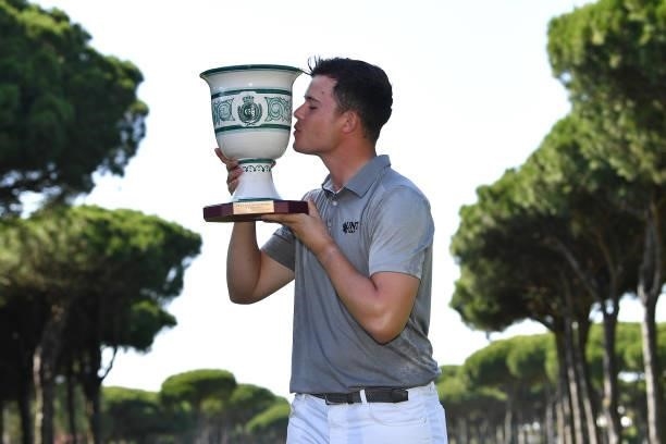 Kristof Ulenaers of Belgium kisses the trophy after his win during the final round of the Challenge de Cadiz at Iberostar Real Club de Golf Novo...